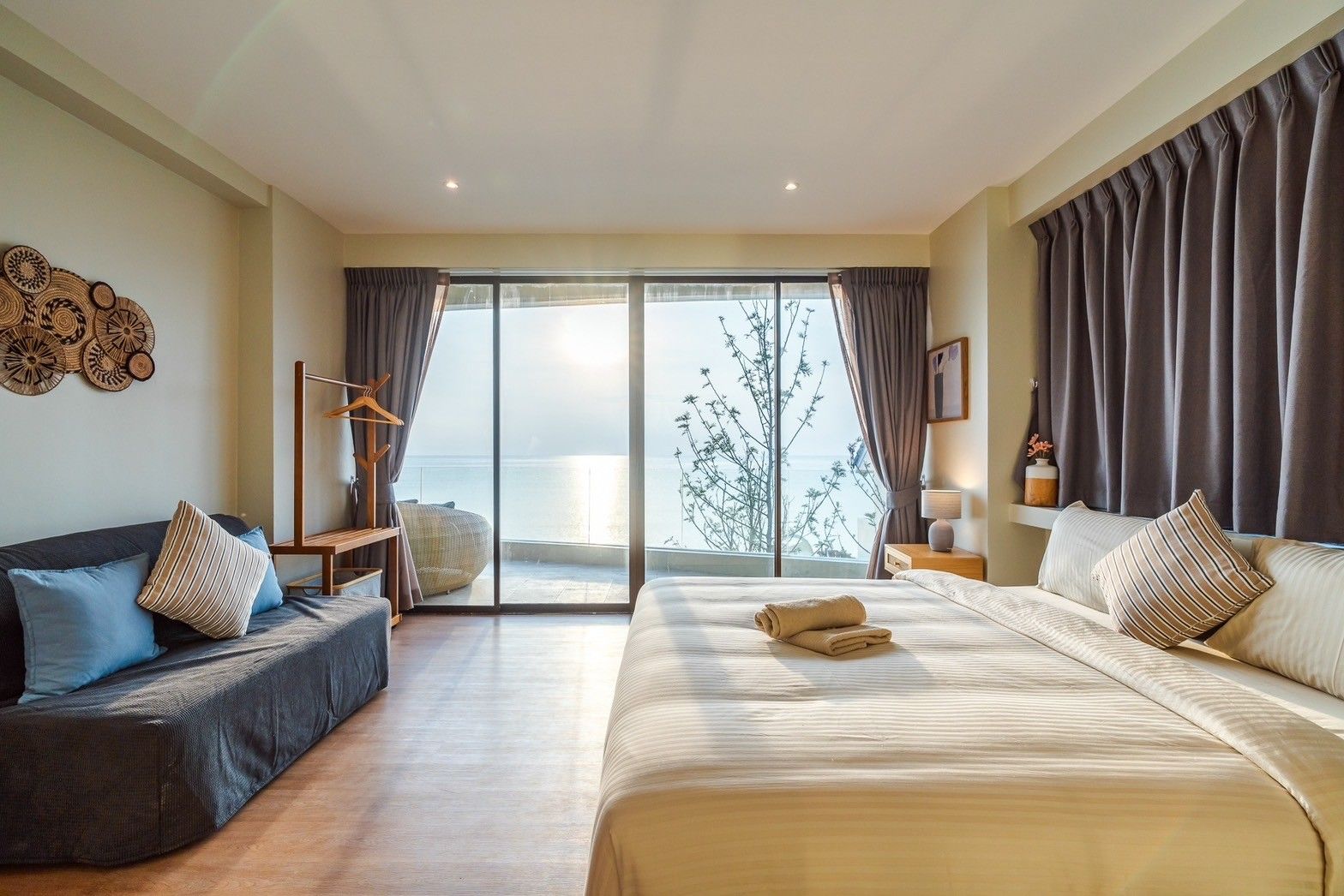 Bright bedroom suite with ocean view at All About VII Pool Villa, near Bangket Beach, Cha Am.