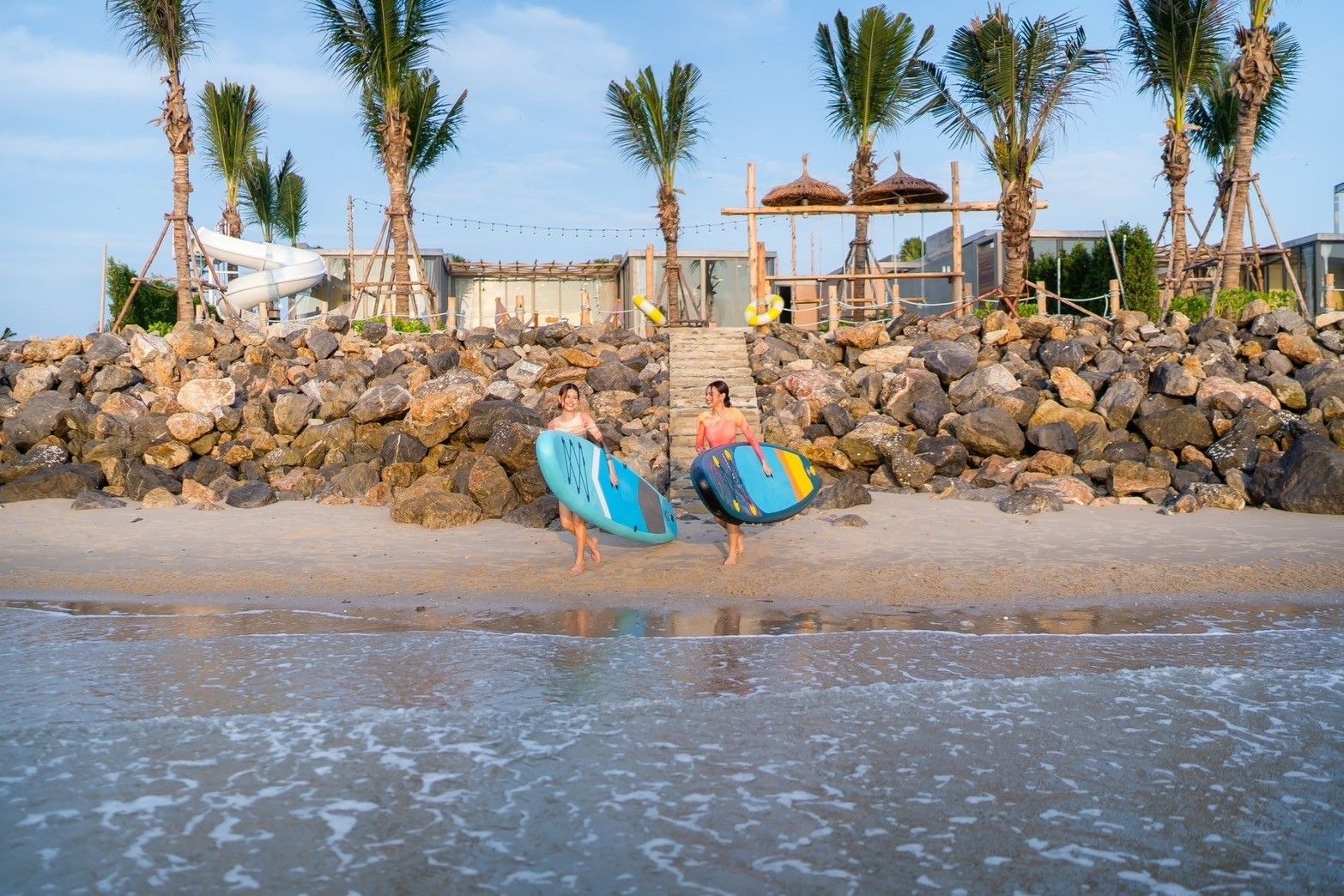 Amore' B Pool Villa, Cha-Am beachfront access with surfboards for guests to enjoy the ocean.