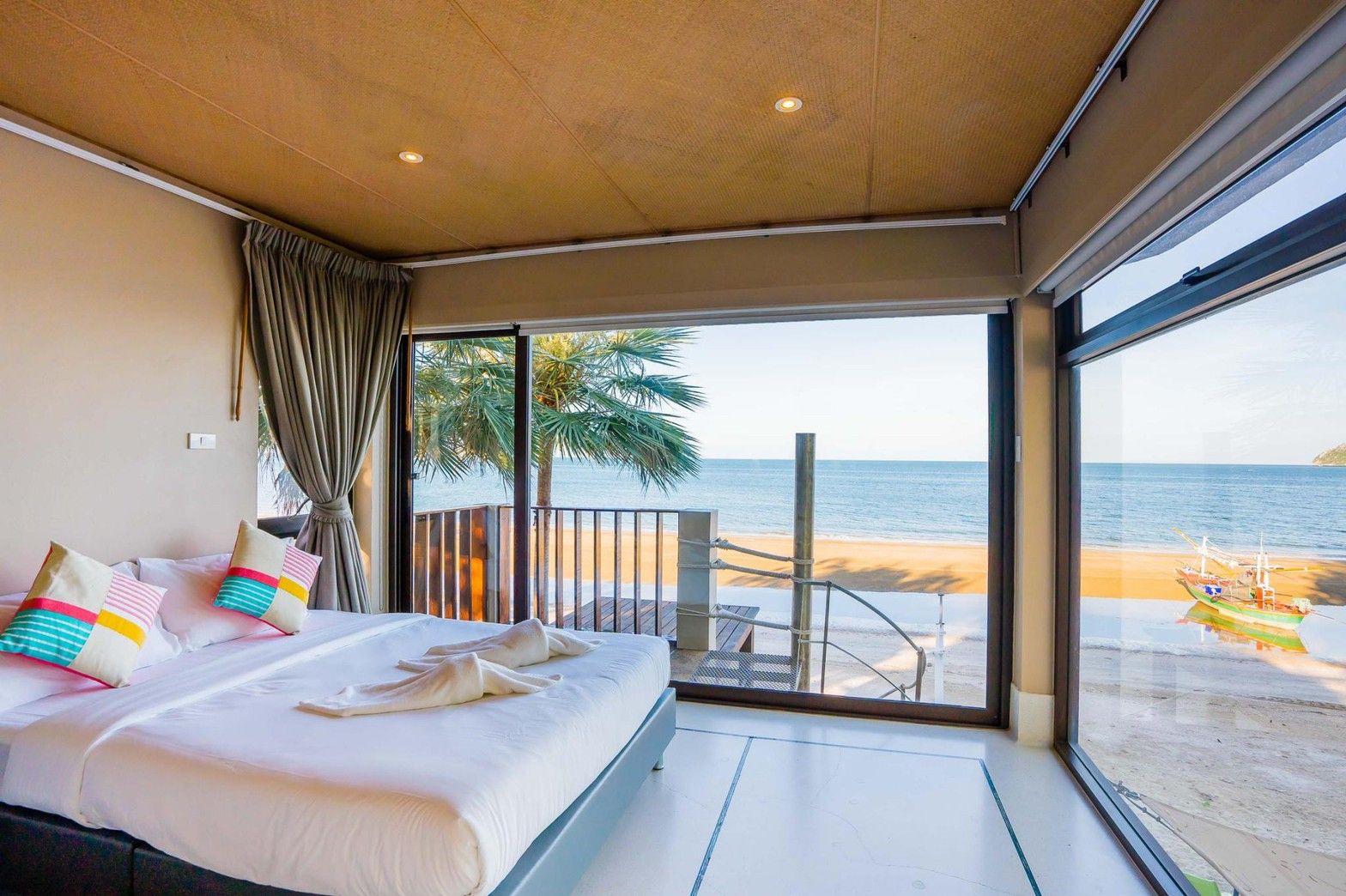 Aqua Pran II pool villa bedroom with ocean view. King bed, beach access in เขาสามร้อยยอด ปราณฯ, Thailand.
