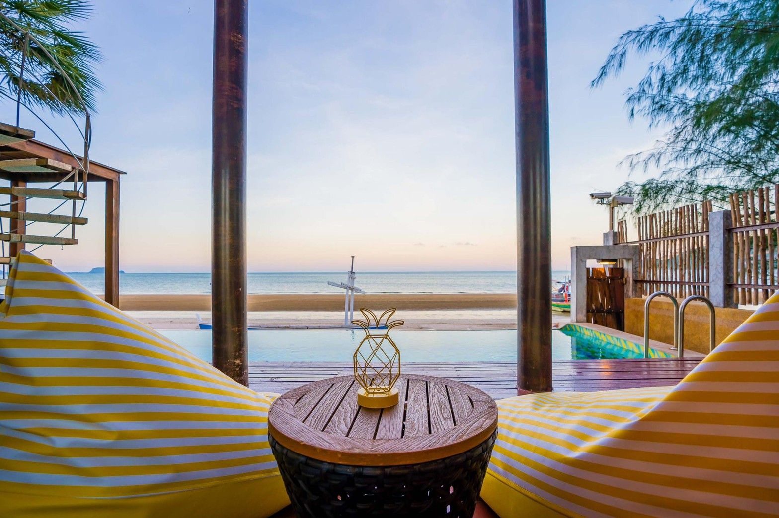 Aqua Pran II pool villa view of the beach from beanbag chairs. เขาสามร้อยยอด ปราณฯ beachfront rental.
