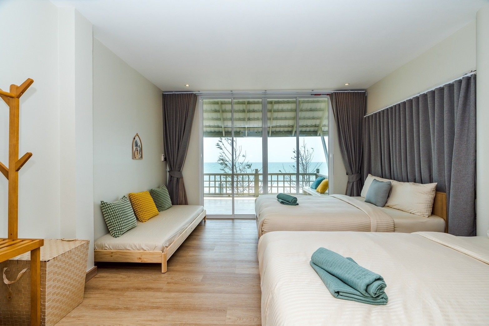 Bright bedroom with three beds and ocean view at Beach Vibe-Two V Pool Villa, ติดทะเล ใกล้หาดบางเกตุ ชะอำ.