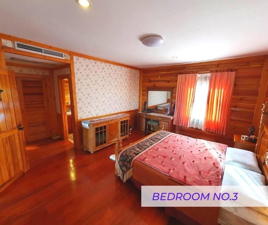 Bedroom 3 with wooden walls at Cabin Pool Villa Khao Yai.
