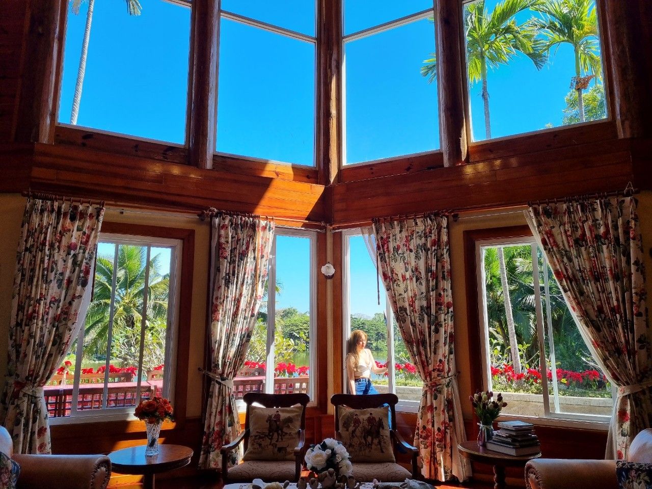 Floor-to-ceiling windows flooding the living room with natural light.