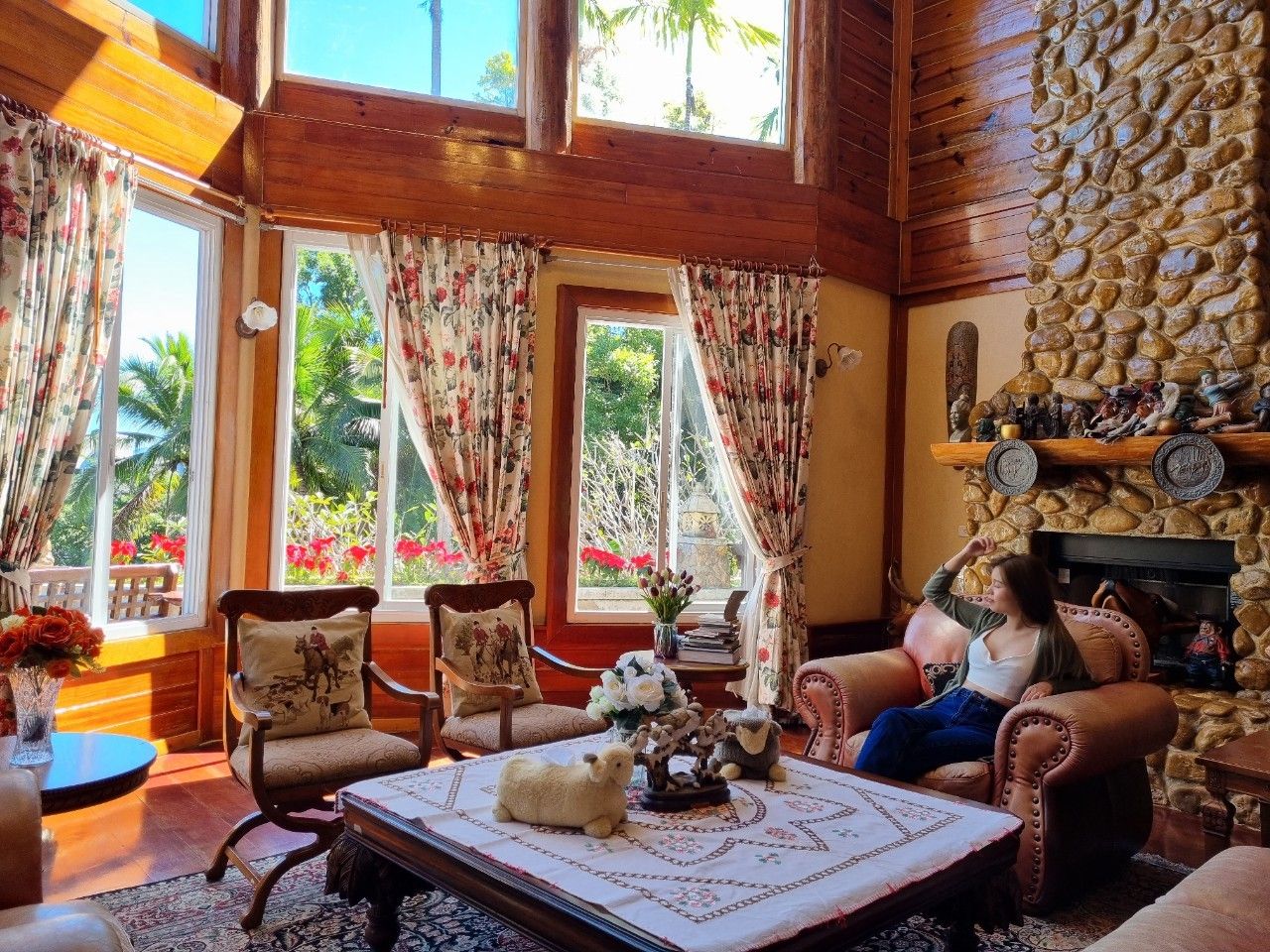 Pet-friendly living room with stone fireplace and dog.