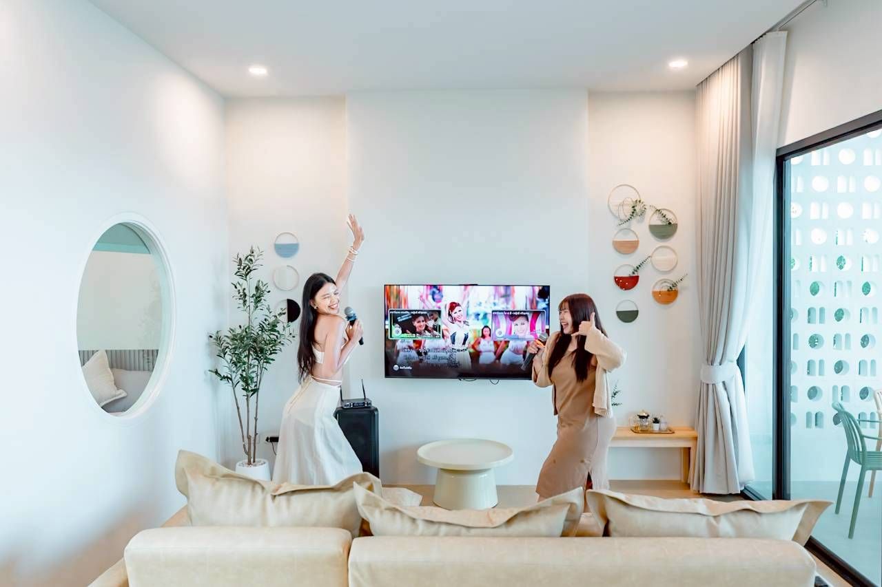 Karaoke fun in the living room at Darlington IV Pool Villa. Enjoy singing with friends and family.