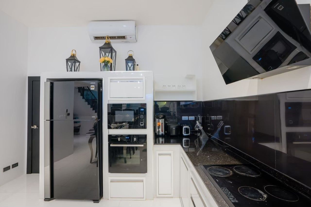 King bedroom with decorative lighting at Emerald VII Pool Villa