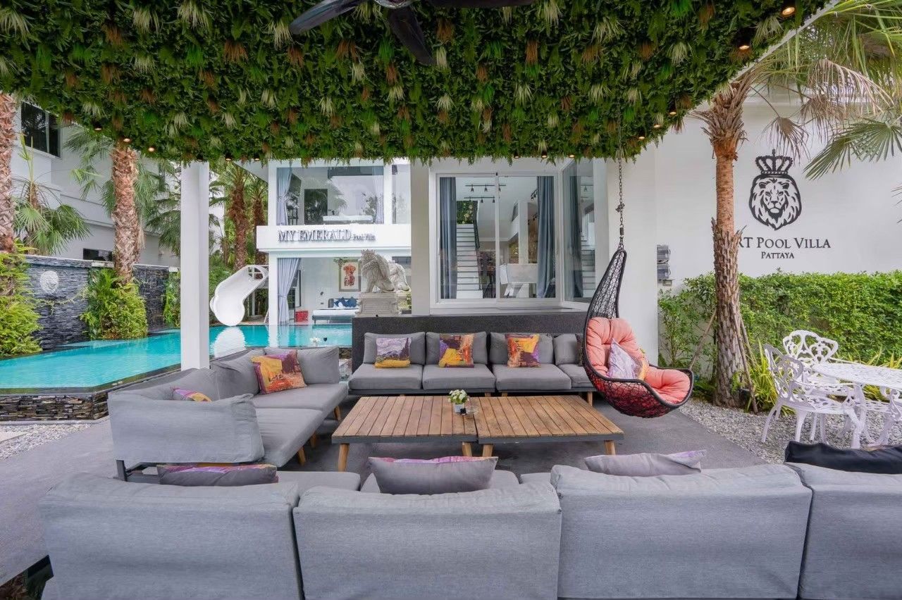 Indoor dining table with chandelier at Emerald VII Pool Villa