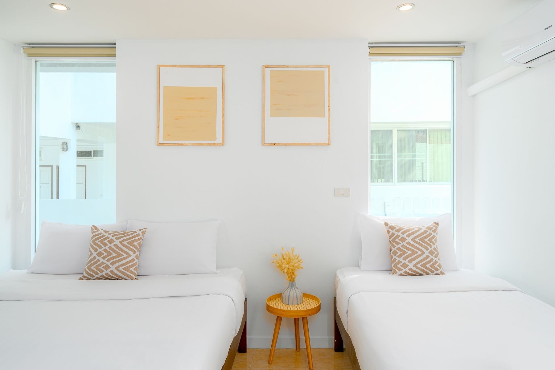 Twin bedroom at G Villa III Pool Villa, Pak Nam Pran. Two beds with white linens and modern artwork.