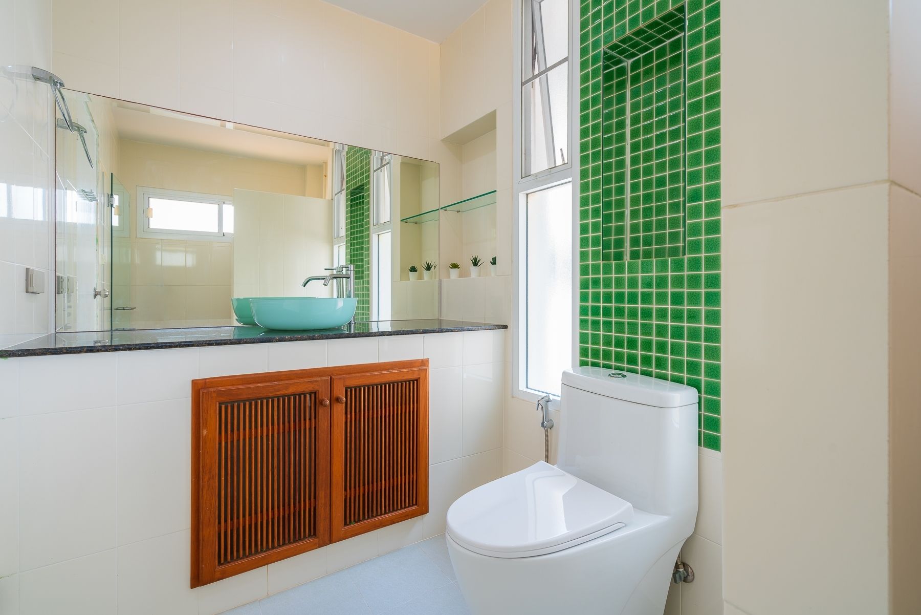 G Villa III Pool Villa, Pak Nam Pran. Bathroom with green tile accent wall, modern toilet, and unique vessel sink.