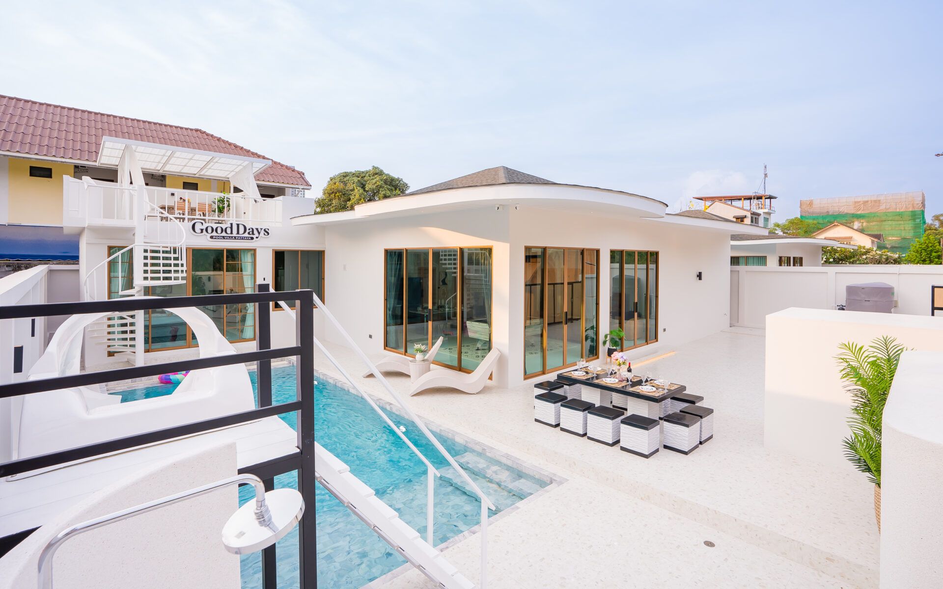 Good Day V Pool Villa in South Pattaya. View of the pool and outdoor dining area on the pool deck.