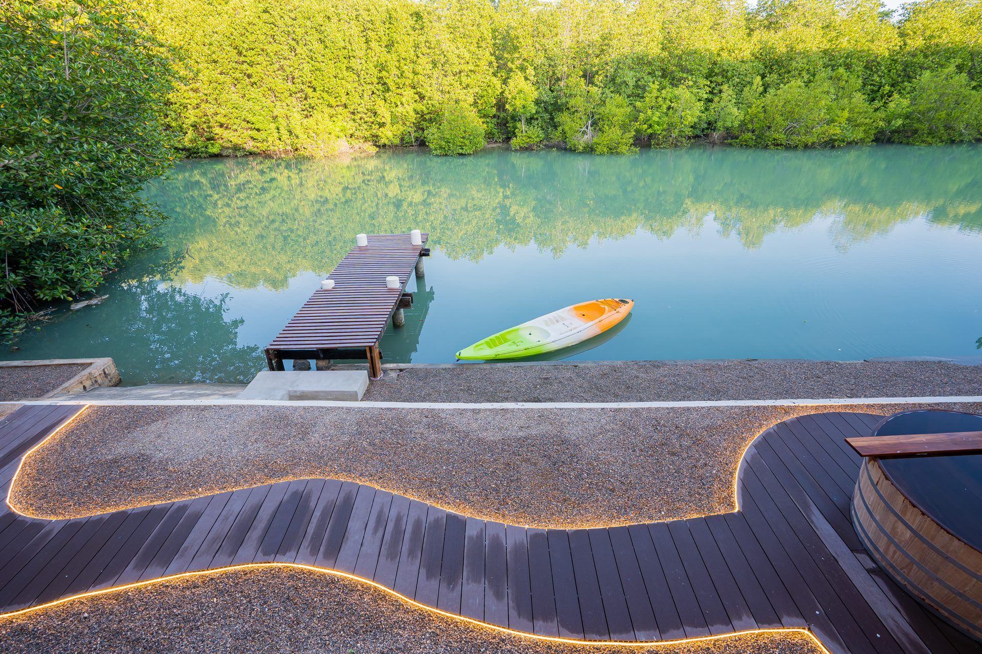 Lagoon Beach V Pool Villa features a kayak and wooden dock on the water, ใกล้หาดบางเก่า-ชะอำ.