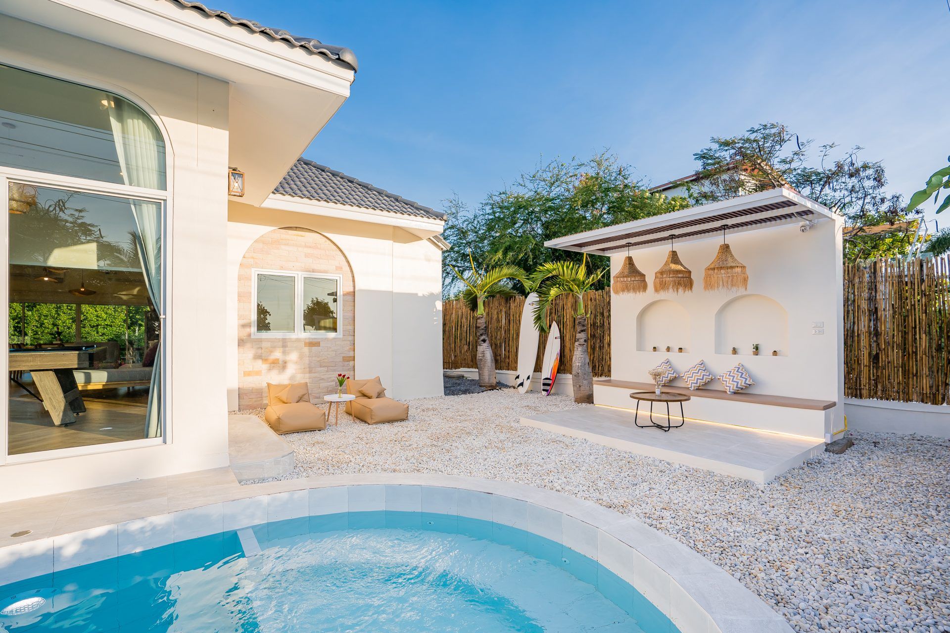 Lagoon Beach V Pool Villa plunge pool and outdoor lounge area, ใกล้หาดบางเก่า-ชะอำ. Surfboards add a beachy vibe.