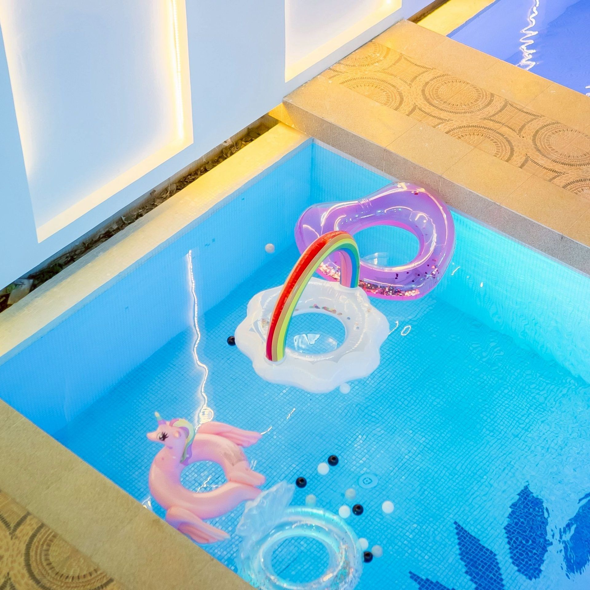 Pool close-up with fun floats at Land VIII