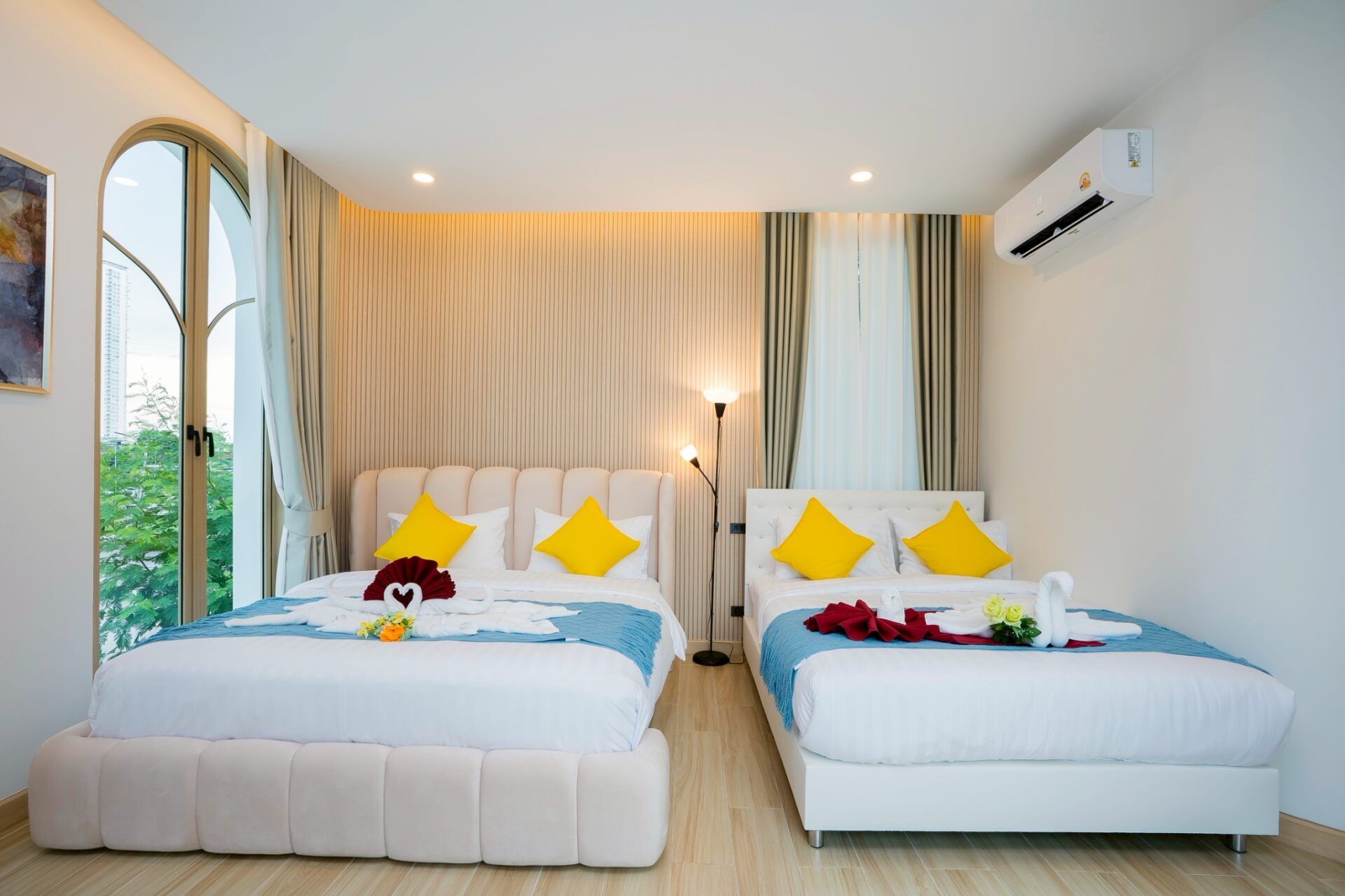 Open-plan living area with TV at Noble V Pool Villa