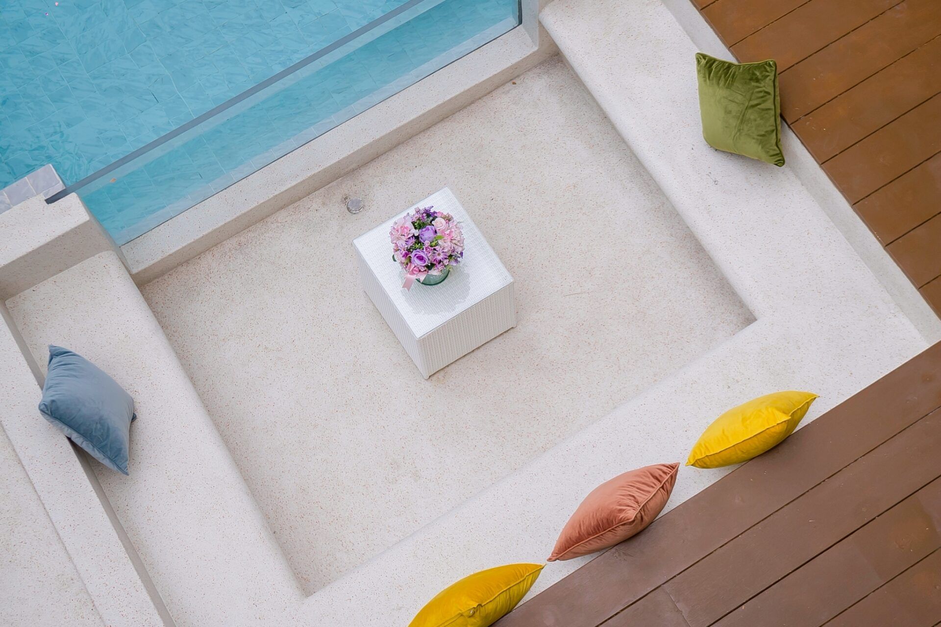 Pool at twilight with sunken lounge at Noble V