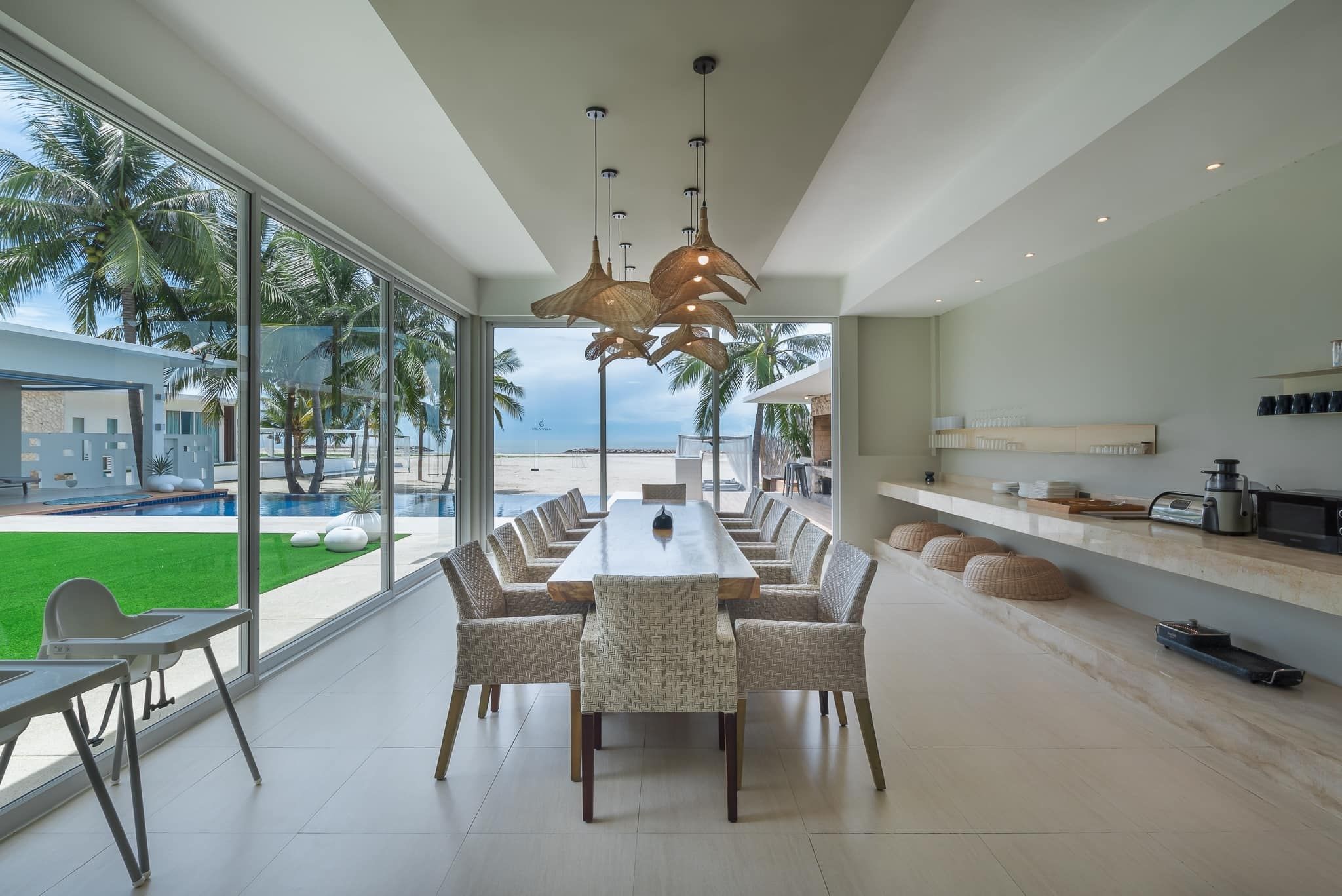 Spacious dining area with ocean view at Vela VII Pool Villa, Cha-Am, Thailand