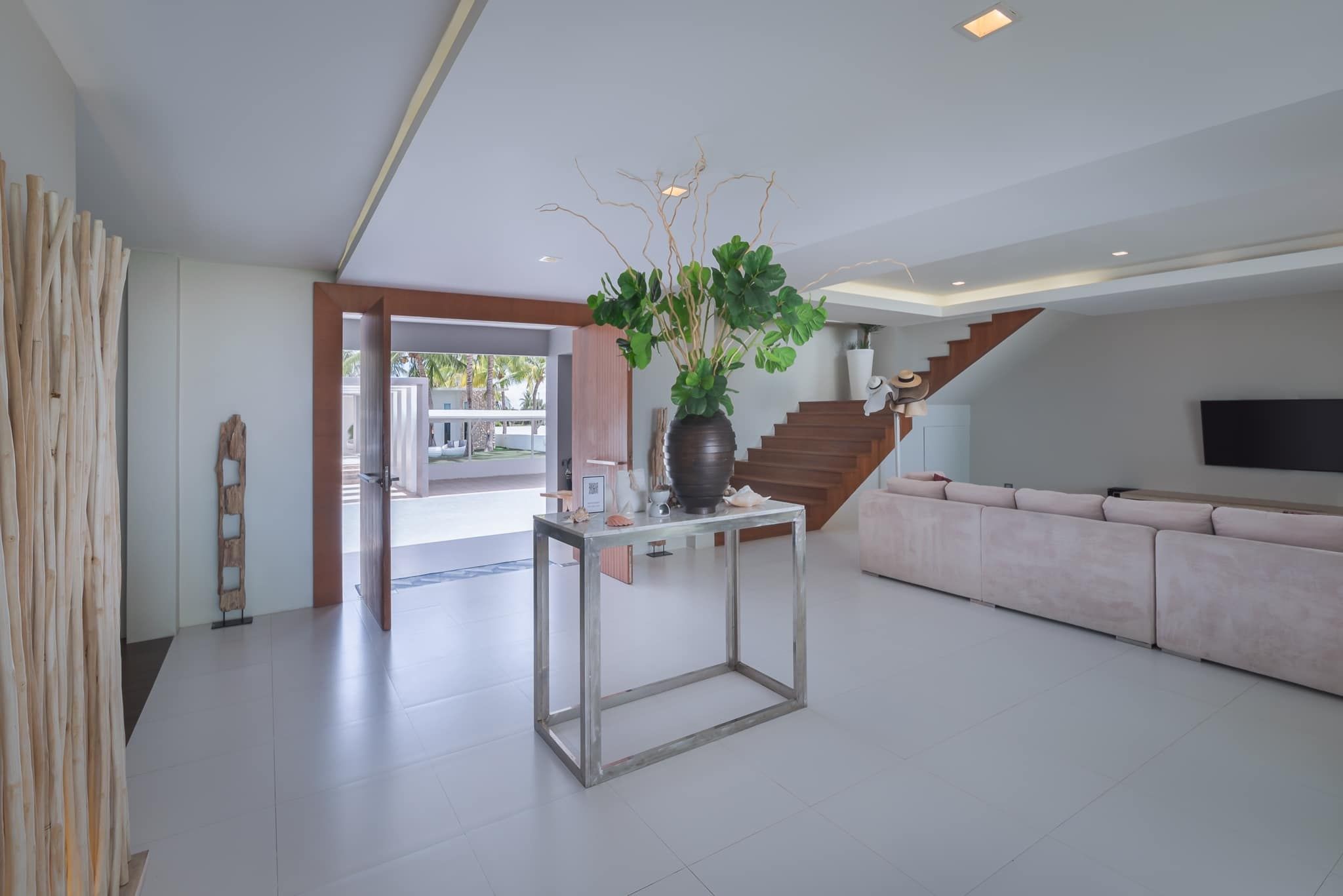 Vela VII Pool Villa Cha-Am grand entrance hall with modern decor and view to the pool.