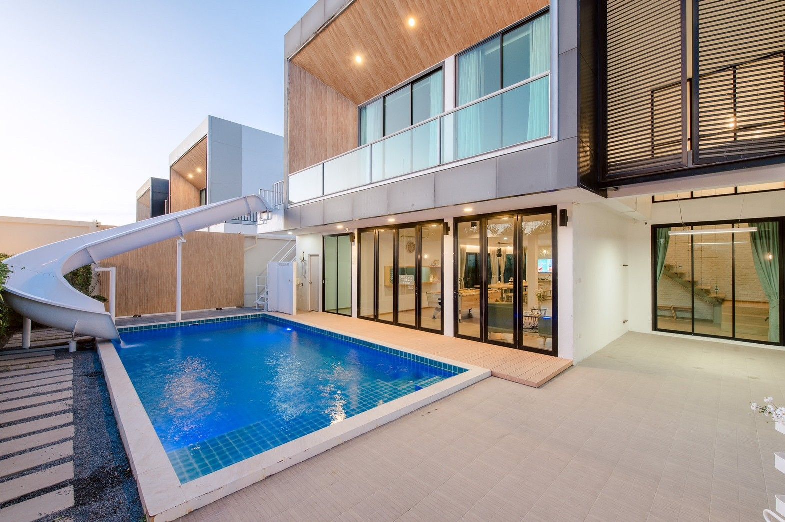 Pool with waterslide at Pool Lay AII Pool Villa, Na Jomtien, Pattaya. Modern villa with private pool.