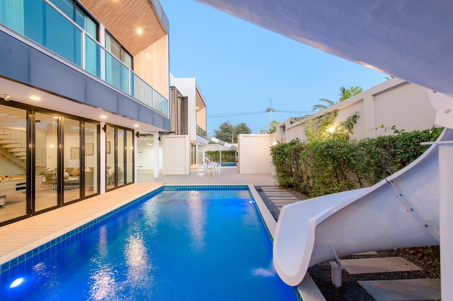 Stunning pool with waterslide at Pool Lay AII Pool Villa, Na Jomtien. Modern villa with pool view.
