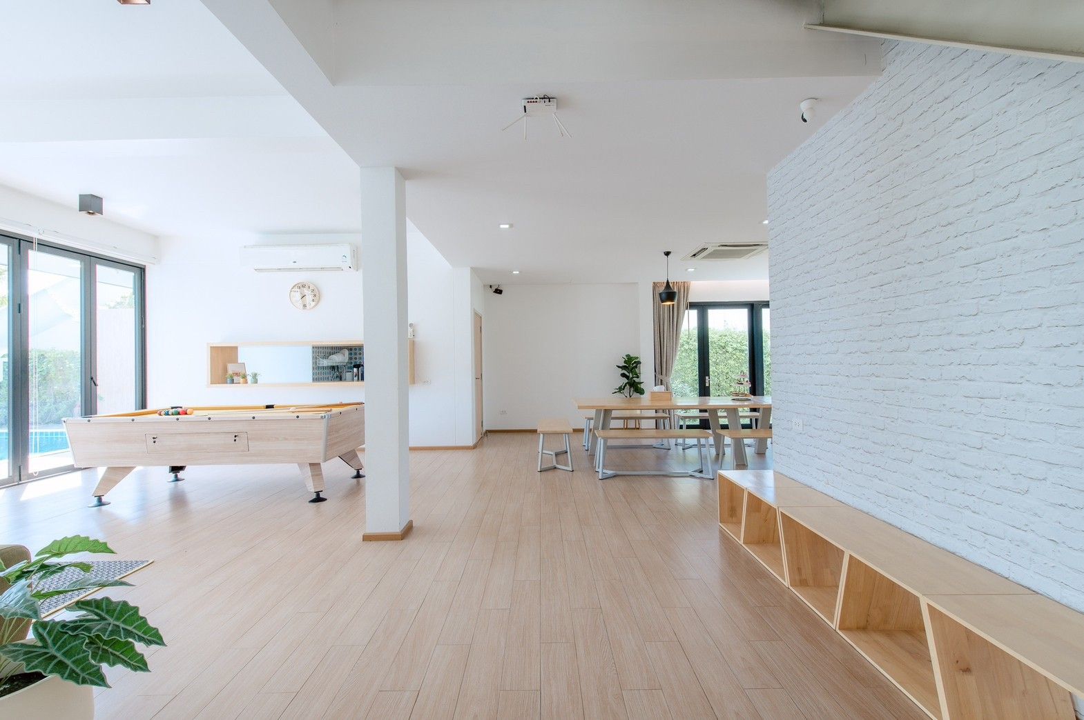 Bright open floor plan at Pool Lay AII Pool Villa, Na Jomtien, Pattaya. Features a pool table and dining area.