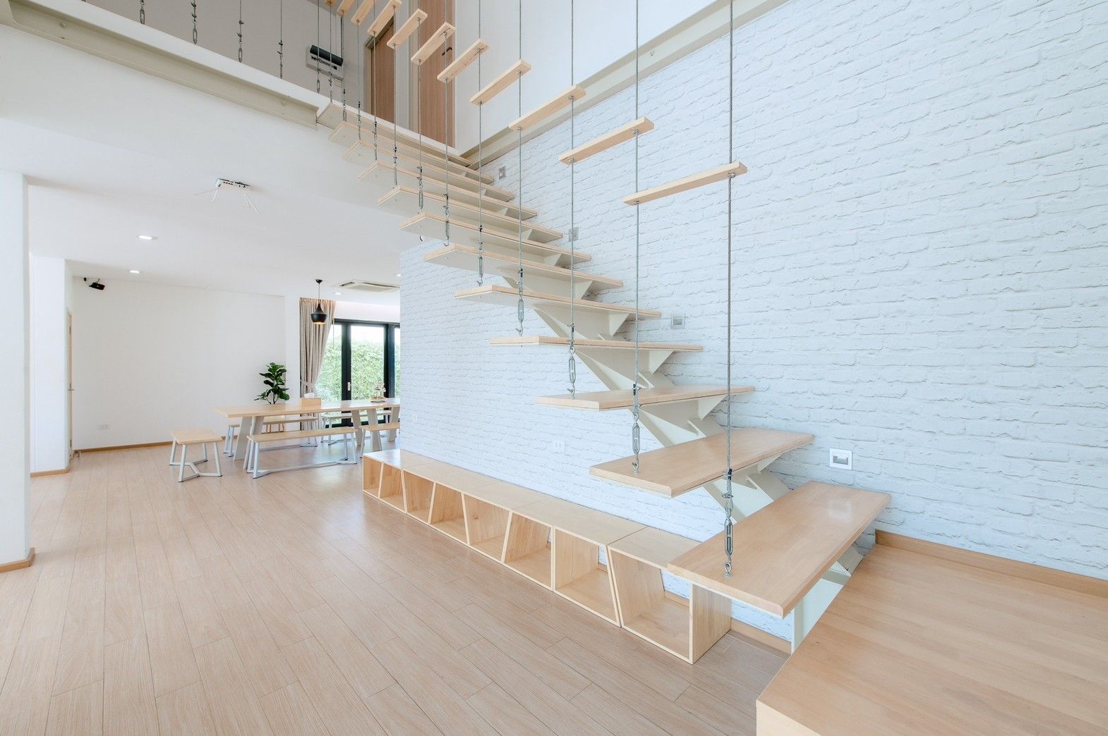 Unique floating staircase design at Pool Lay AII Pool Villa, Na Jomtien, Pattaya. Modern and stylish villa interior.