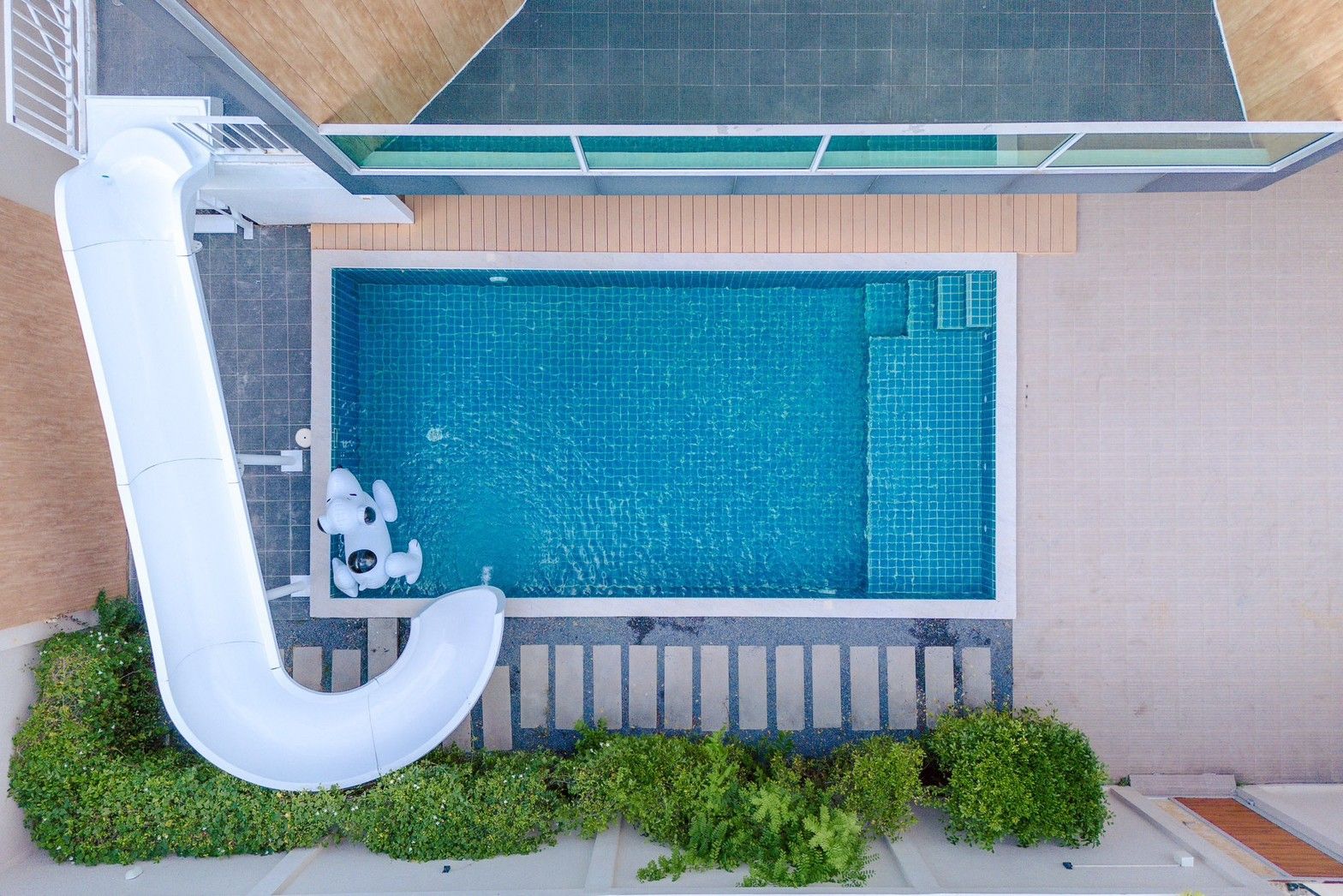 Aerial view of the pool and waterslide at Pool Lay AII Pool Villa, Na Jomtien, Pattaya.