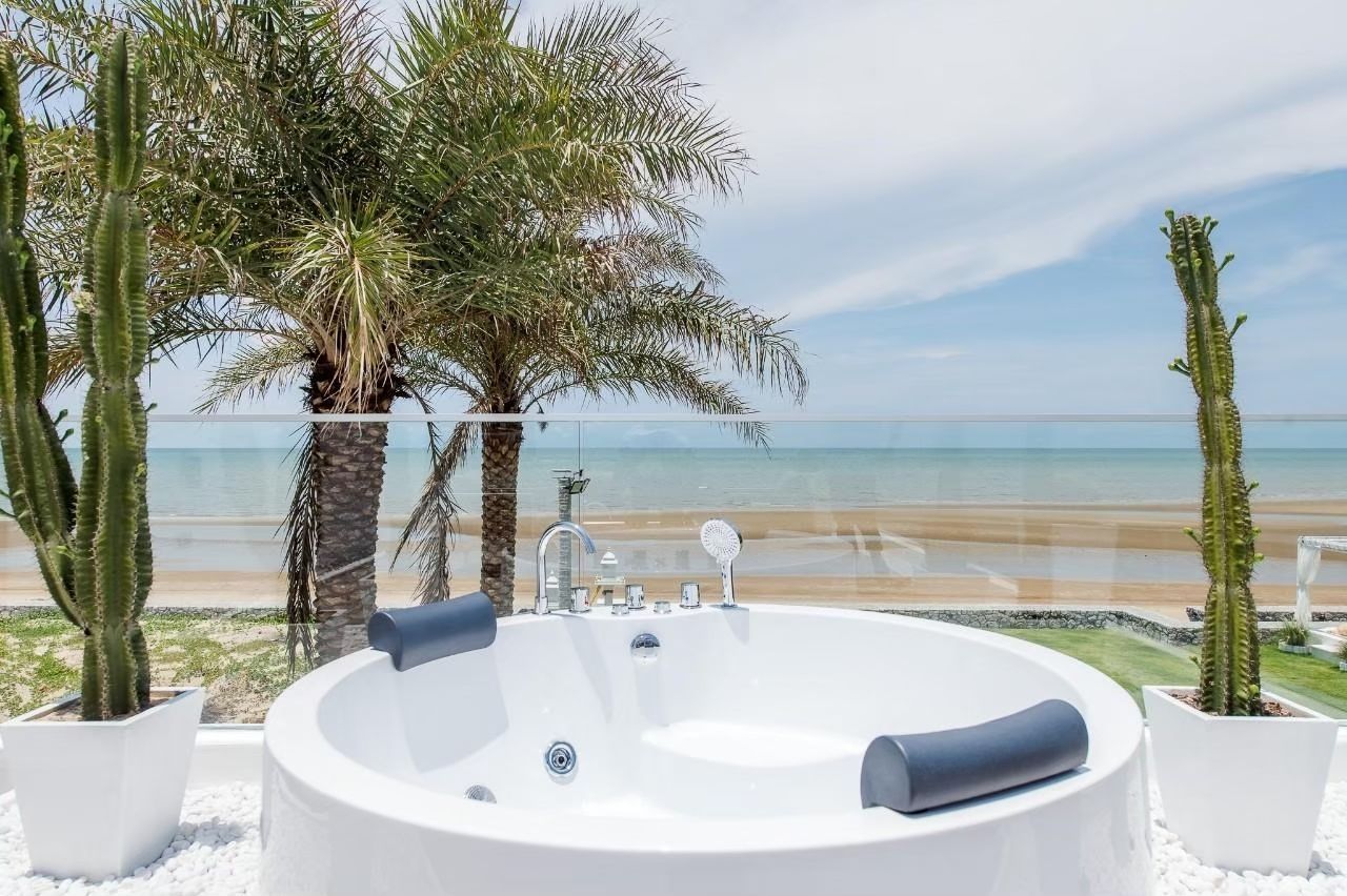 Ocean view from the outdoor bathtub at Private Heaven VI Pool Villa, Cha-Am. Relax with a soak and enjoy the beach view.