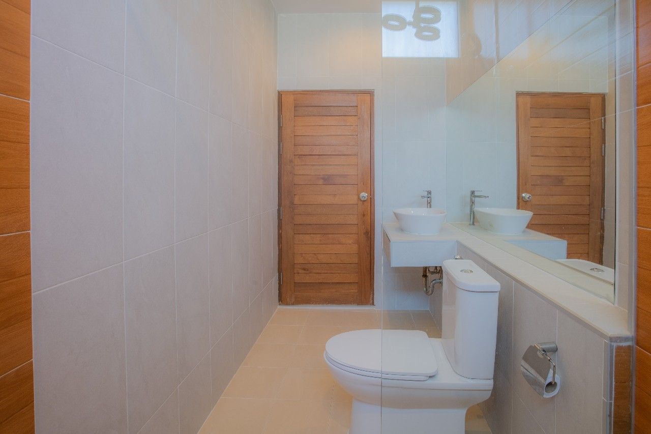 Bright bathroom with double sinks at Proud I Pool Villa Hua Hin, Thailand.