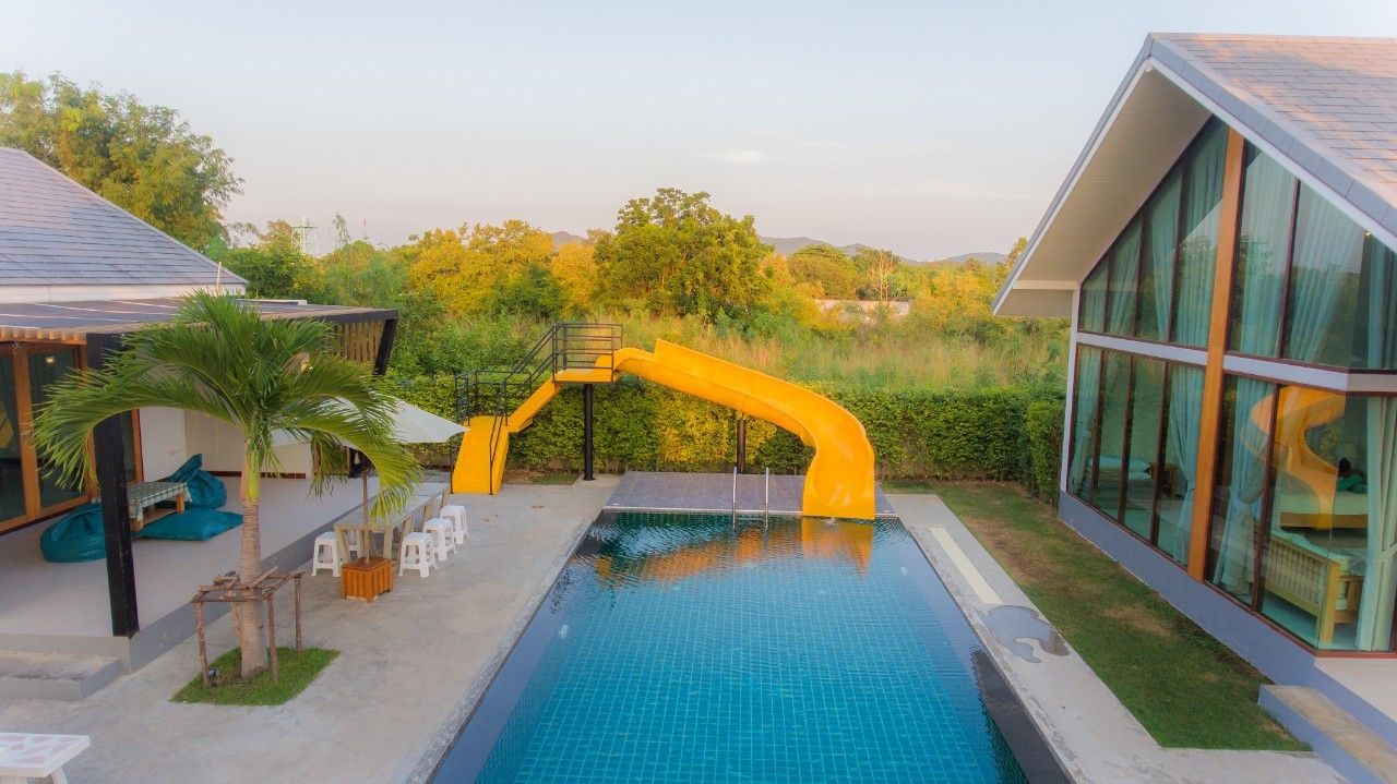Stunning pool with waterslide at Proud II Pool Villa, Hua Hin. Perfect for family fun and relaxation.