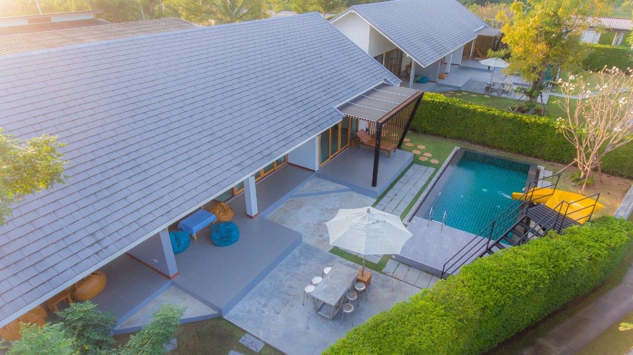 Aerial view of Proud IV Pool Villa in Hua Hin, Thailand, showcasing the pool, patio, and villa layout.