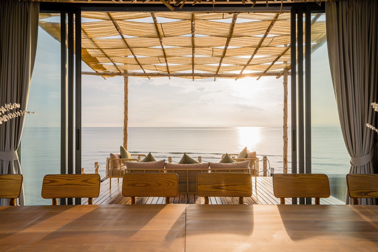 Ocean view from the dining table at Sea Fan IV Beachfront Pool Villa near Huahin airport. Coastal dining experience.