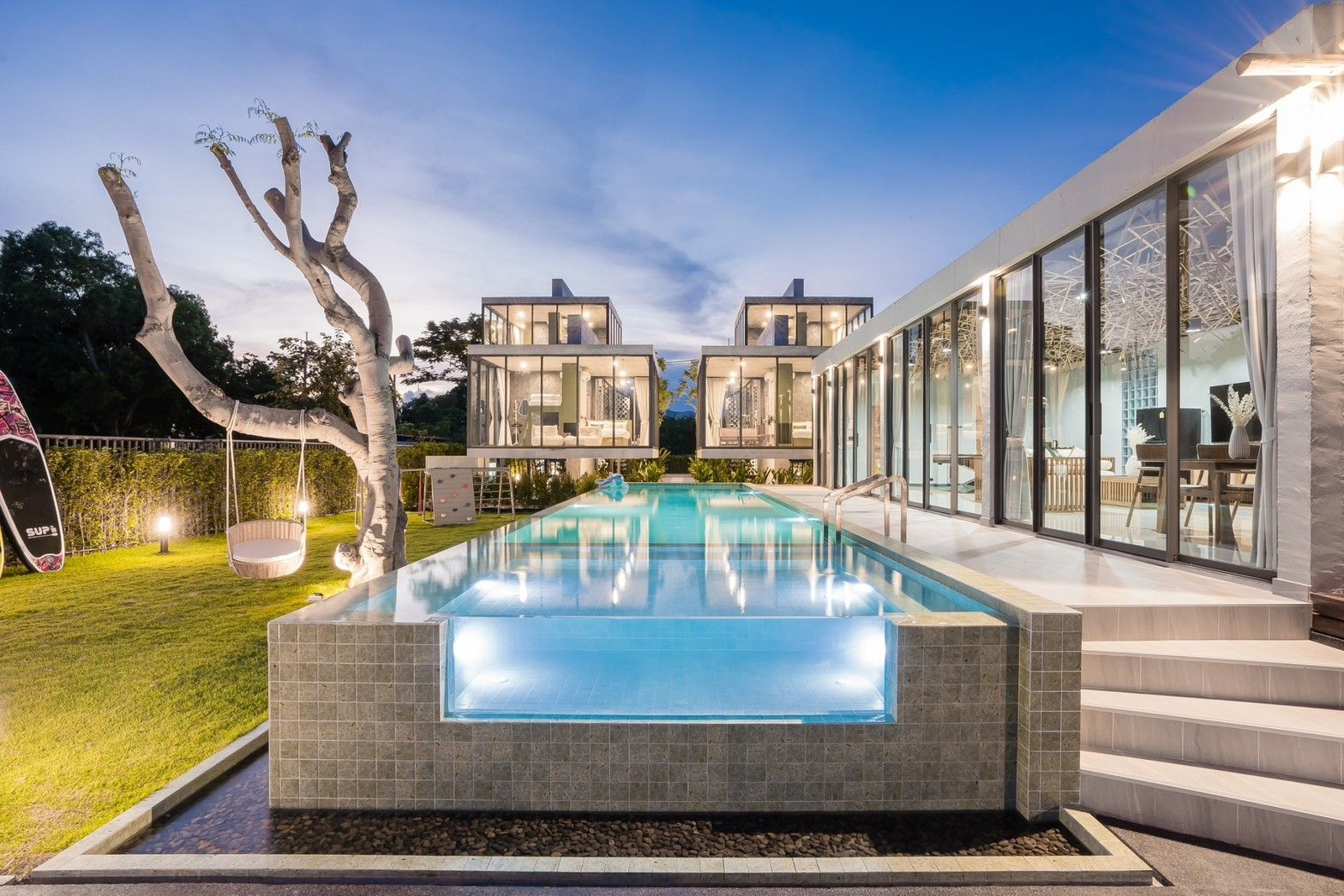 Stunning glass-panel pool at Sea Fan IV Beachfront Pool Villa near Huahin airport. Modern design, clear water, inviting for a