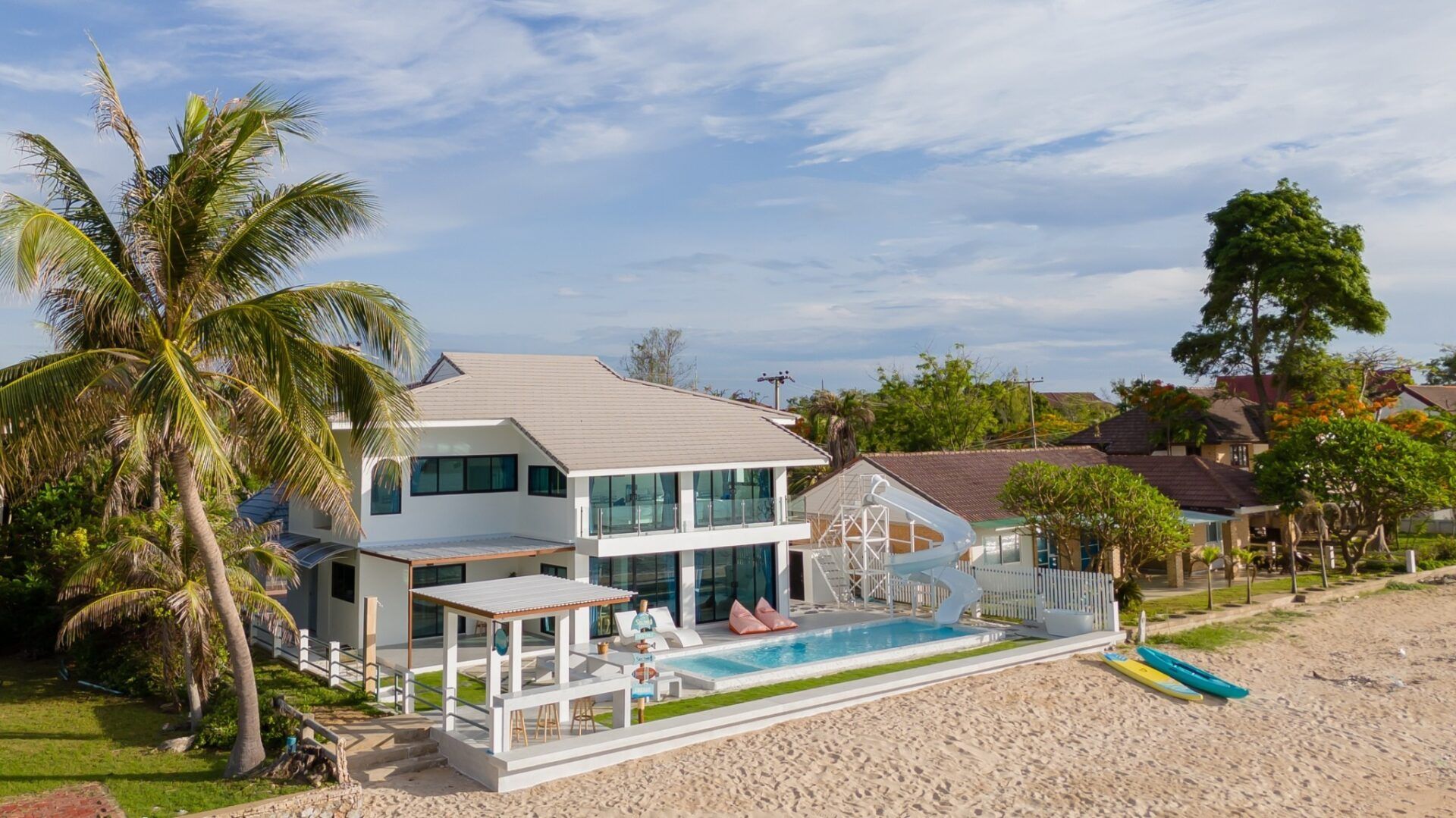 Aerial view of Sea Time V Pool Villa in Cha-Am, Thailand, showcasing its beachfront location and private pool with waterslide
