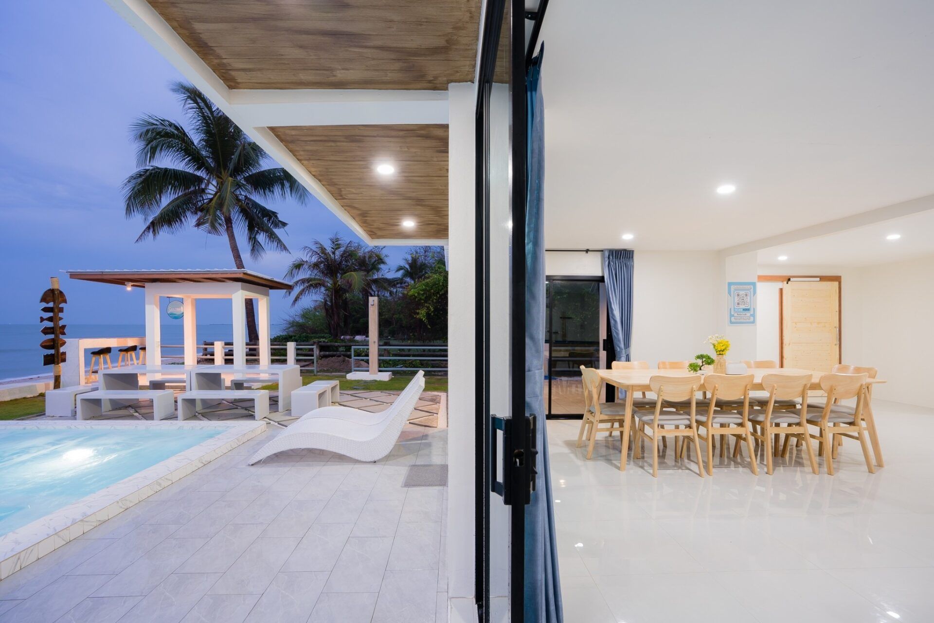 Poolside dining and ocean views at Sea Time V Pool Villa, Cha-Am. Enjoy indoor/outdoor living.