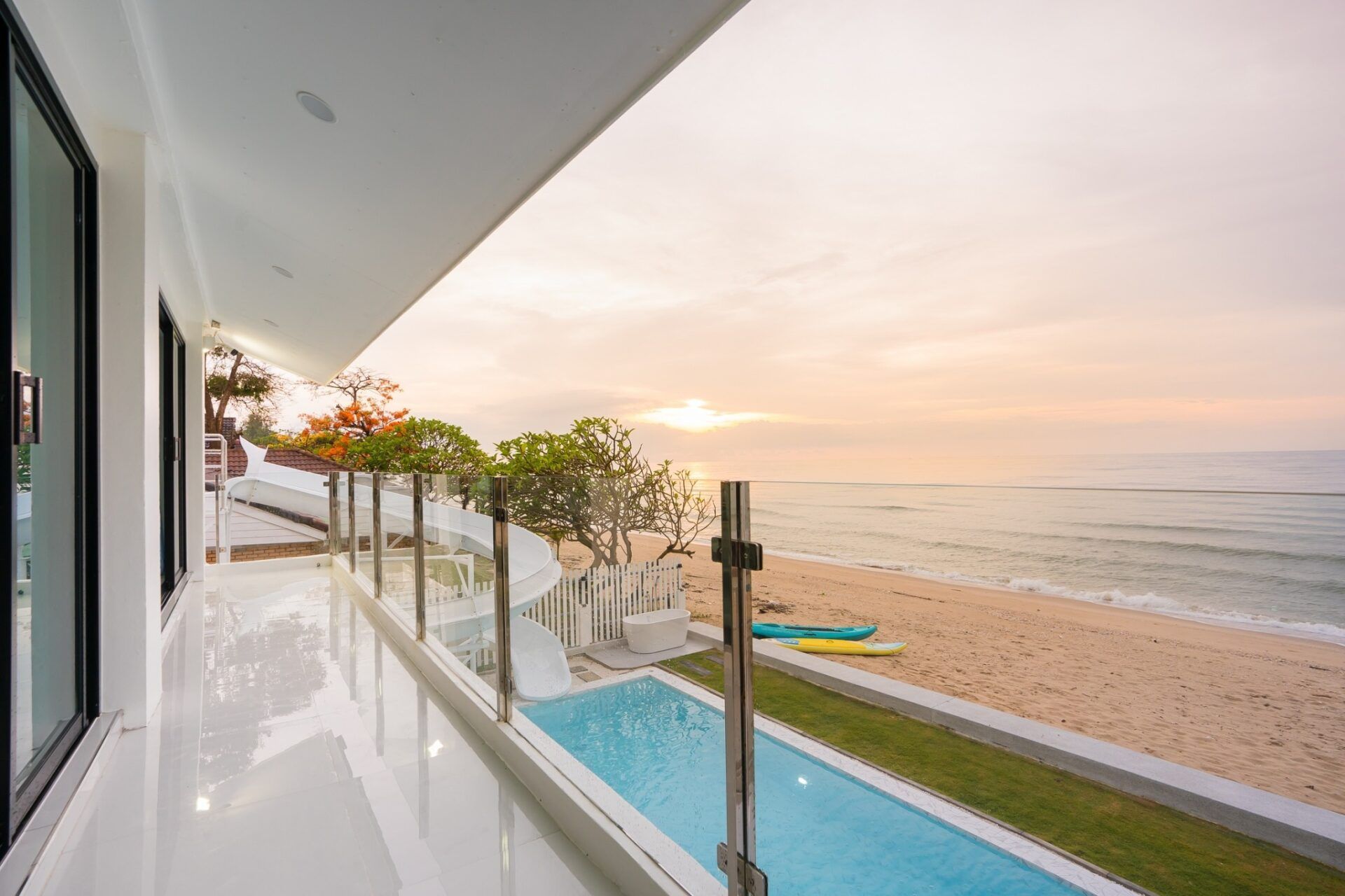 Stunning pool and beach view from Sea Time V Pool Villa in Cha-Am, Thailand. Enjoy the ocean breeze and private pool.