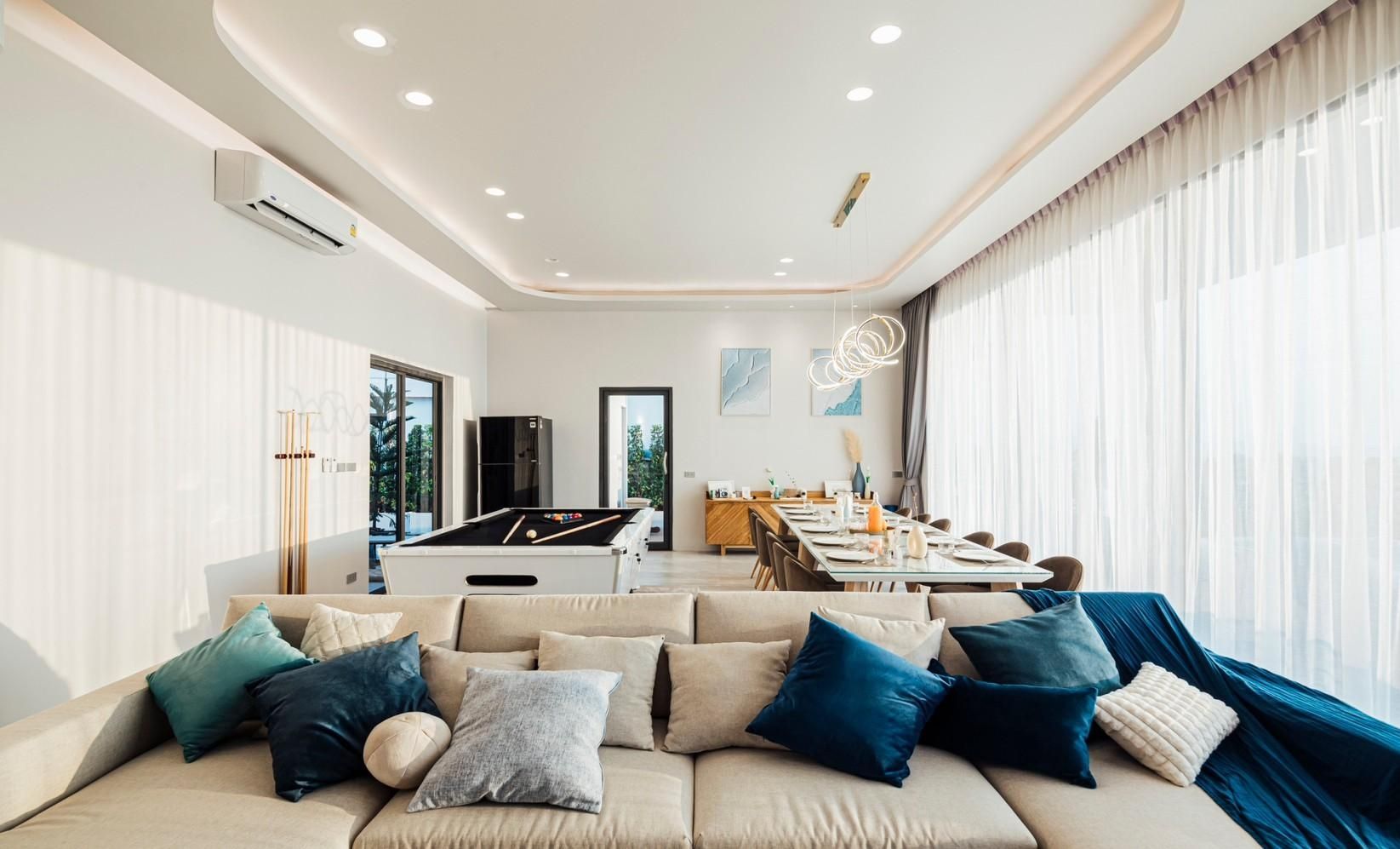 Living area with billiard table and dining table at Shore Season V Pool Villa, Banglamung Pattaya.