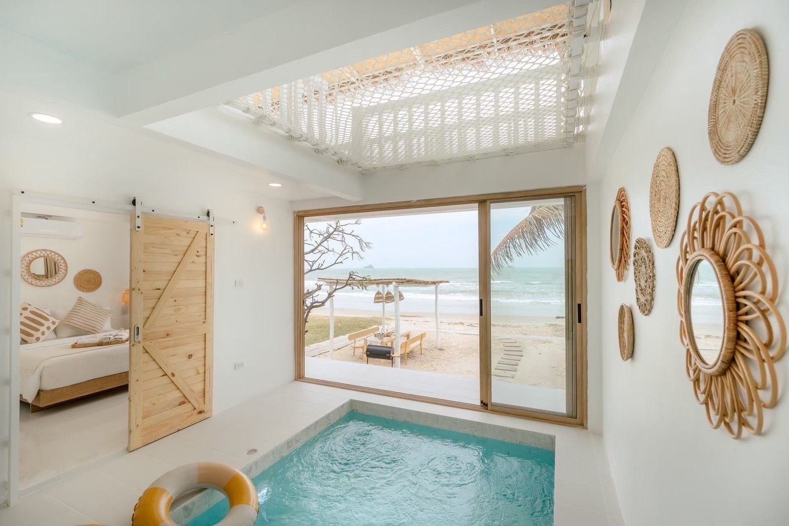 Indoor plunge pool with beach view at Story II Pool Villa, เขาเต่า-หัวหิน. Relax in style at this unique pool villa.