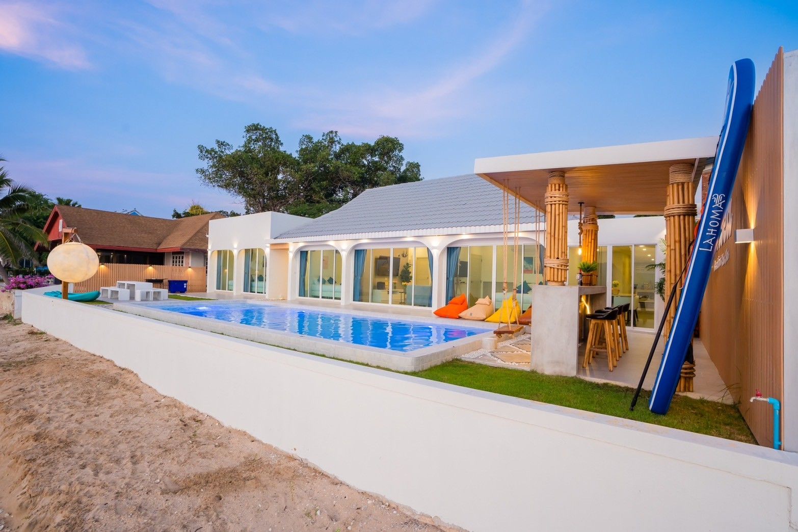 Sun Sea V Pool Villa beachfront view in Cha Am, Thailand. Private pool, outdoor bar, and modern architecture.