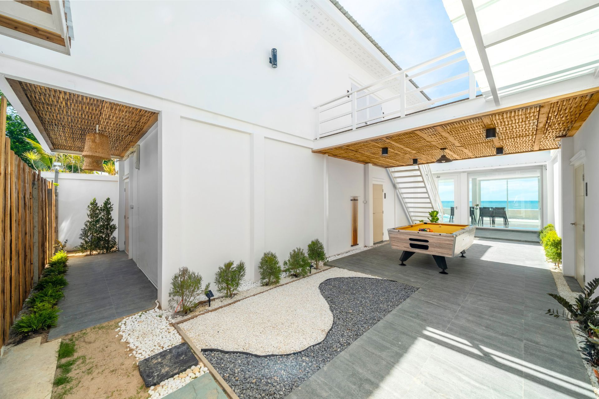 Billiards table in the courtyard of Talay Haus X Pool Villa, หาดเจ้าสำราญ-ชะอำ เพชรบุรี. View of the ocean.