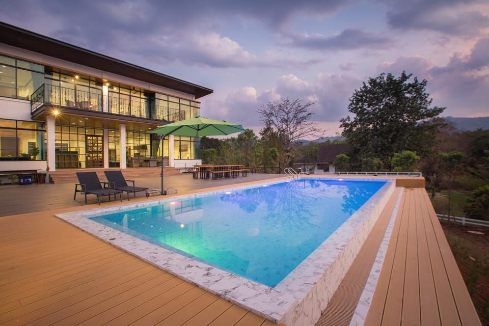 The Valley Khaoyai V Villa pool with deck and lounge chairs in Khao Yai, Thailand.
