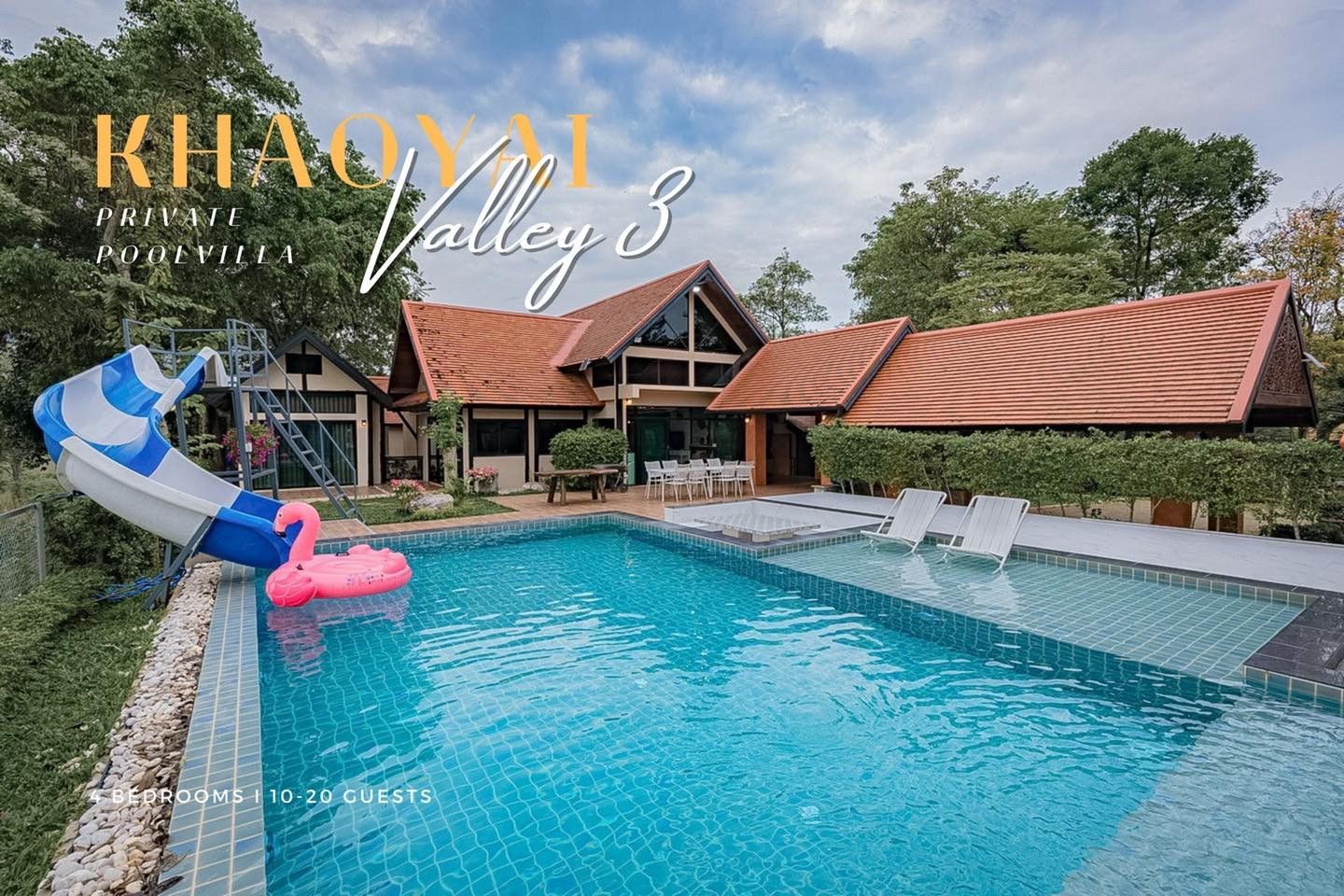 The Valley Khaoyai III pool villa with water slide and pink flamingo float. Loungers in shallow pool area.