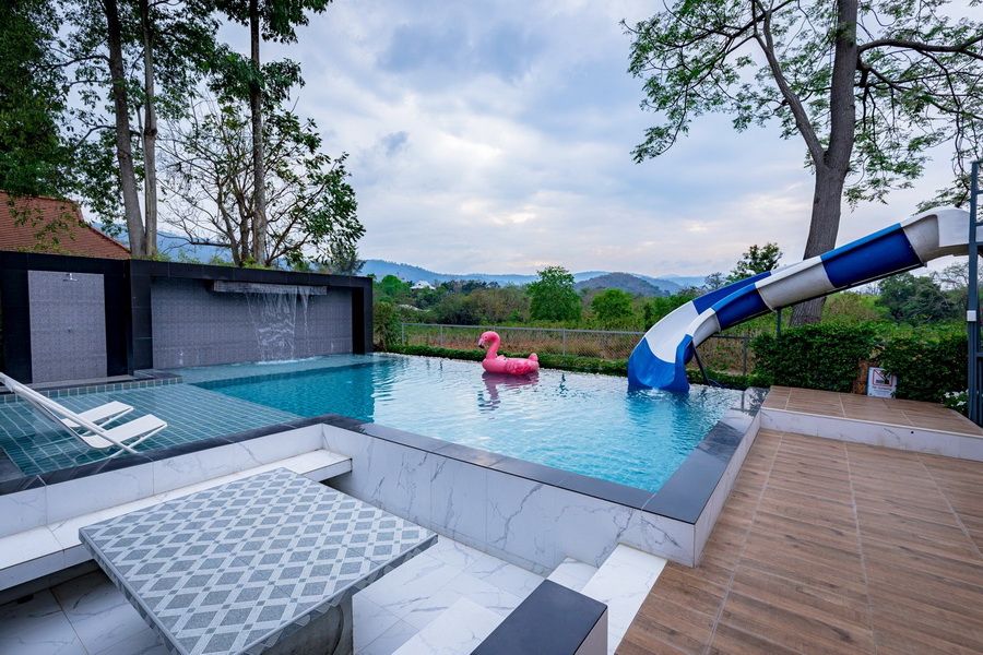The Valley Khaoyai III pool villa features a water slide and waterfall feature in the swimming pool, หมูสี เขาใหญ่.