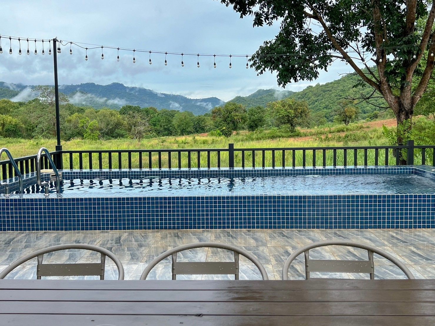 The Valley Khaoyai VIII pool villa view of the mountains from the tiled swimming pool and deck in หมูสี เขาใหญ่.