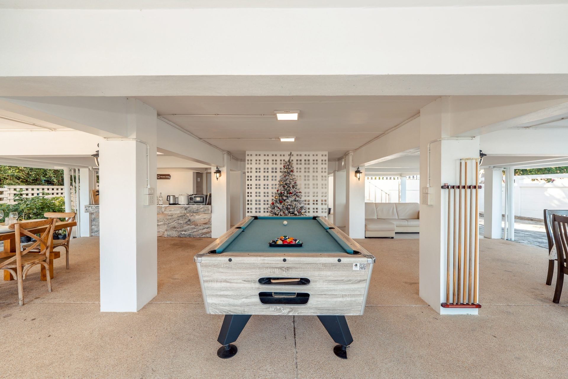 Indoor pool table at Twenty-Six Pool Villa Hua-hin, หัวหิน 101 ประจวบฯ. Billiards and Christmas tree visible.