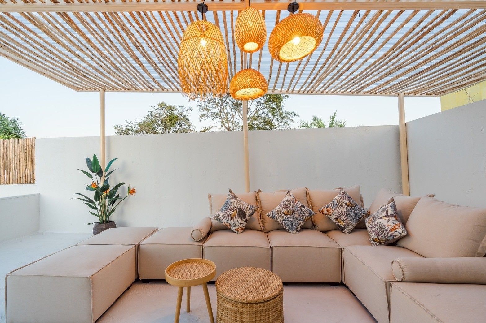 Stylish covered patio seating area at White Coco V Pool Villa, พัทยากลาง-นาเกลือ. Relax on the comfortable sofa and enjoy the