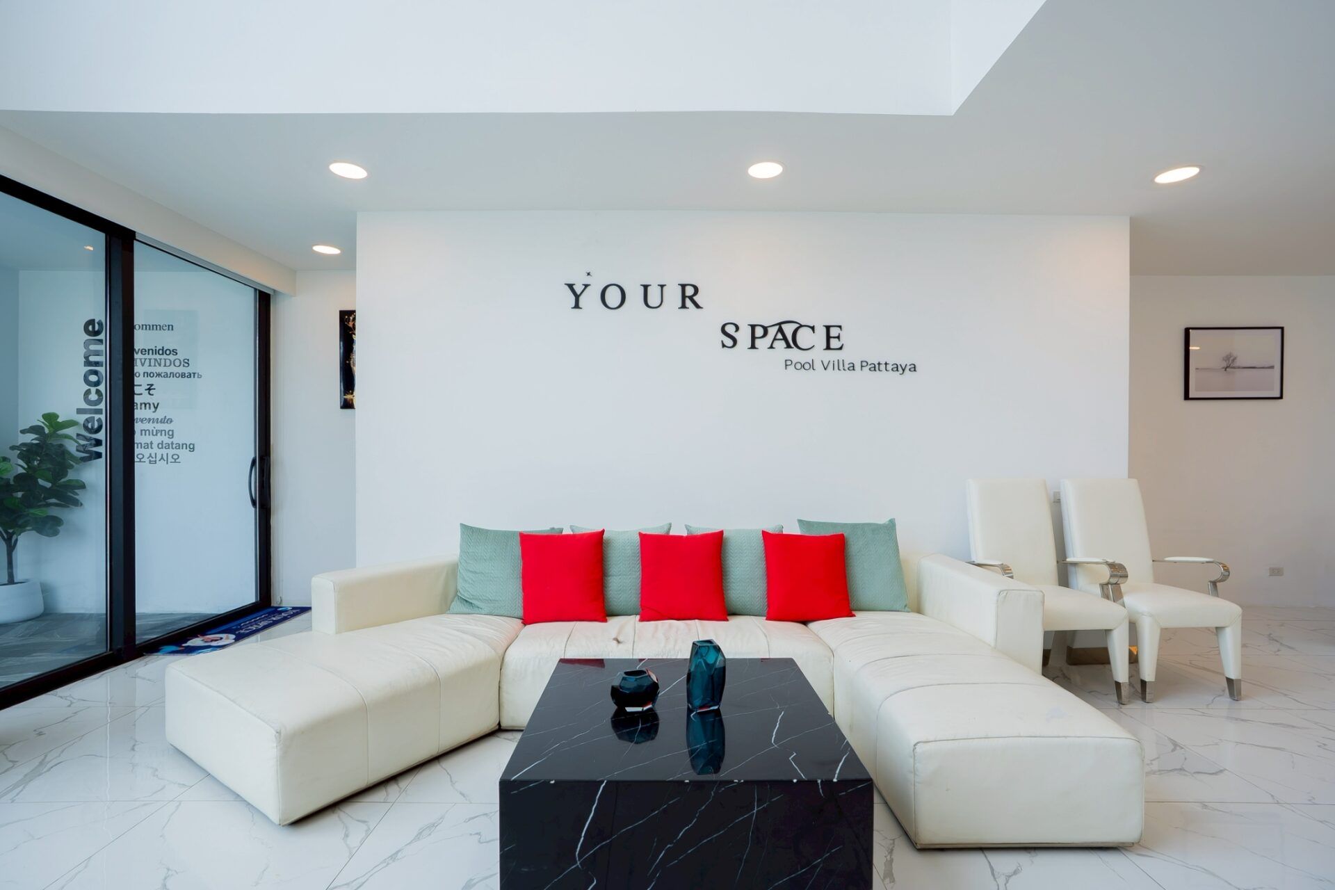 Bedroom with teal throw at Your Space IV Pool Villa