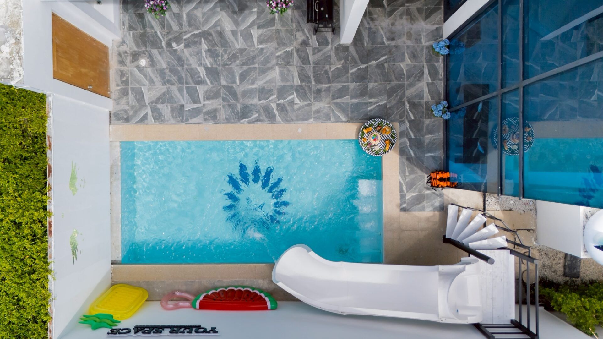 Aerial view of saltwater pool with slide at Your Space IV, Pattaya