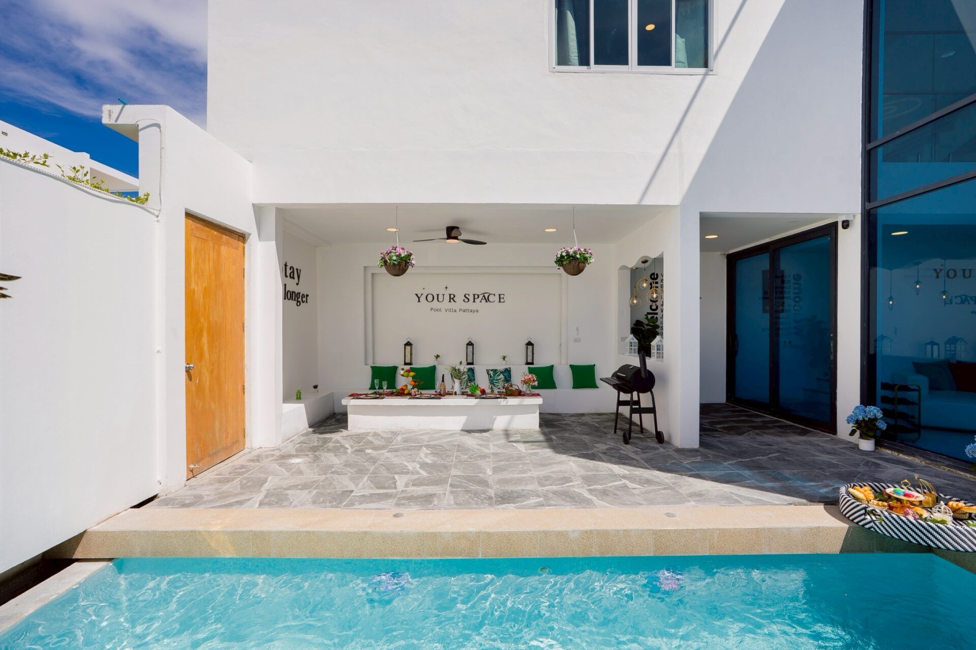 Night pool with glass facade at Your Space IV Pool Villa