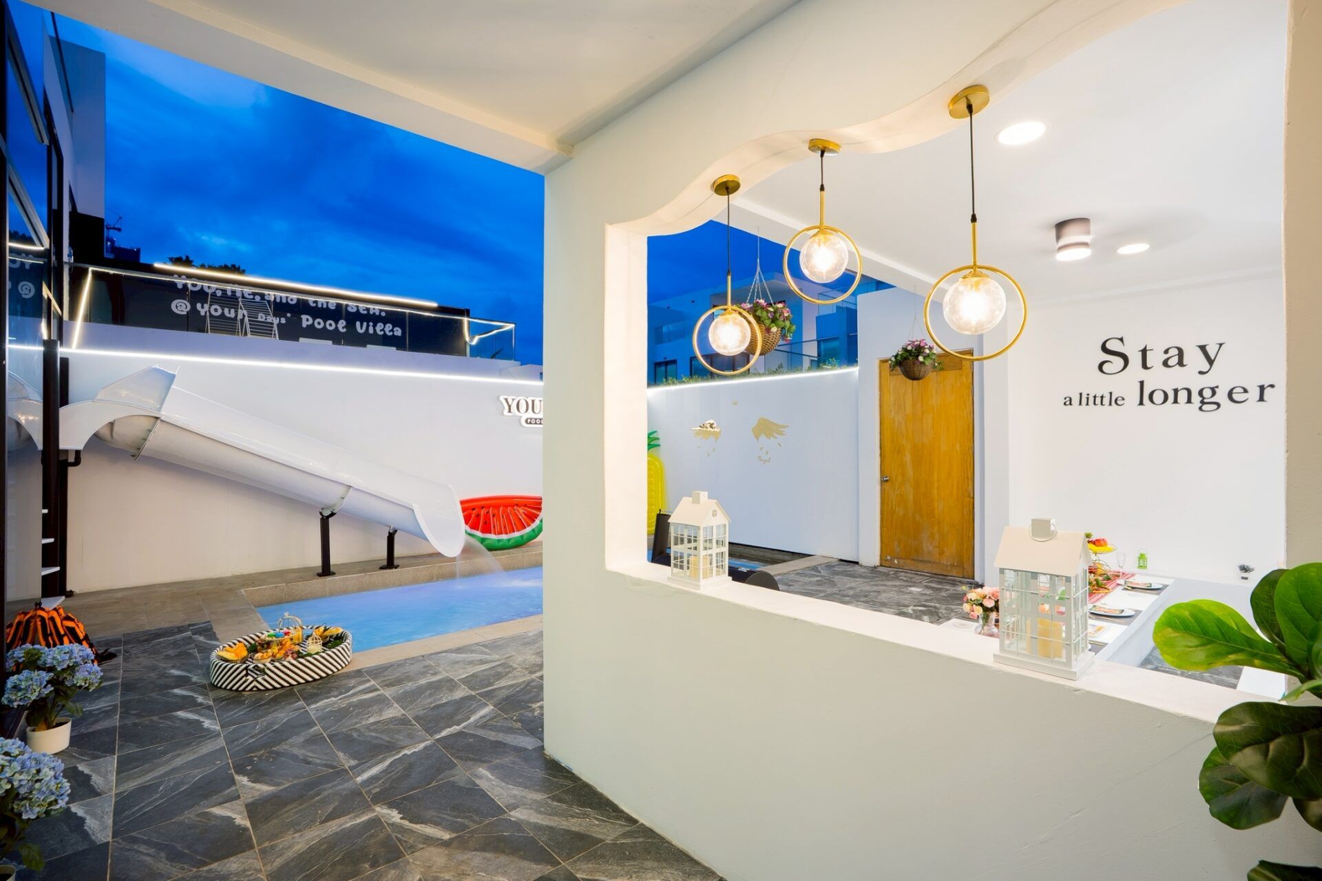 Living room with sofa and YOUR SPACE branding at Your Space IV