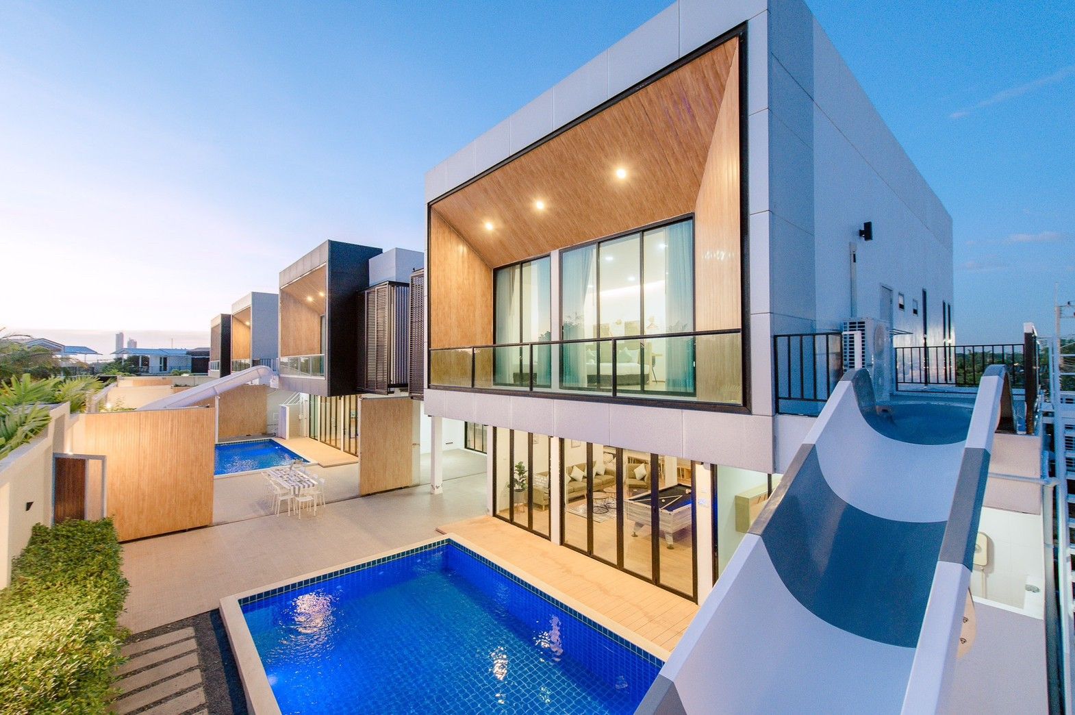 Aerial view of Pool Lay AI Pool Villa in Na Jomtien, Pattaya, featuring a unique water slide into the private pool.